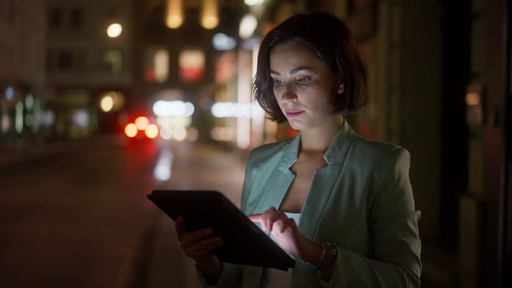Focused Businesswoman Engages With Technology On Vienna Streets