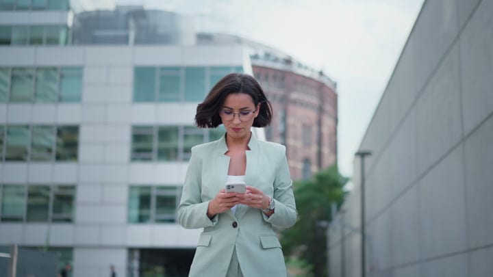 Focused Businesswoman Navigates Her Day in Vienna's Streets