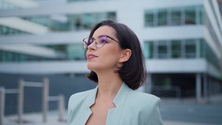 Confident Businesswoman Embraces Vienna's Urban Panorama