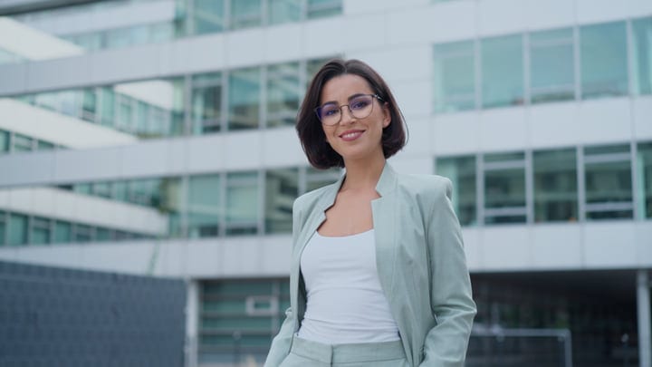 Confident Businesswoman Smiling in Vienna's Urban Landscape