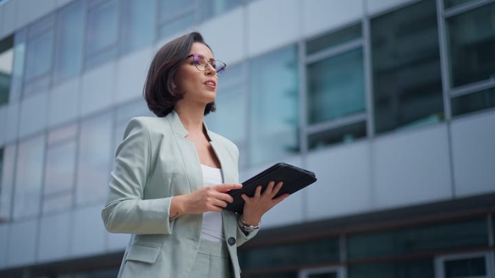 Confident Businesswoman Engages With Digital Tablet In Vienna