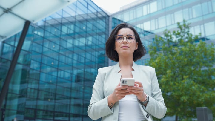 Confident Businesswoman Navigates Vienna's Modern Cityscape
