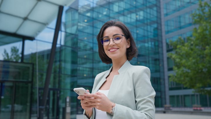 Confident Businesswoman Checking Messages in Vienna Plaza