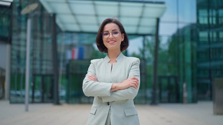 Confident Businesswoman Smiling Outside Modern Vienna Office