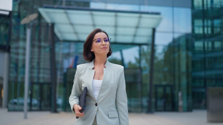 Confident Businesswoman Walking Through Modern Vienna Streets