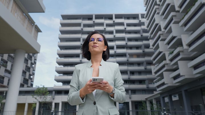 Confident Businesswoman Embraces Innovation In Vienna's Cityscape