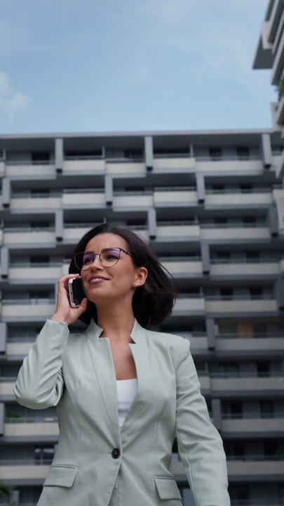 Confident Businesswoman Engaged In A Call In Vienna's Urban Scene