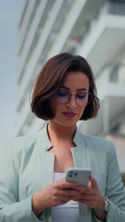 Modern Businesswoman Engages With Digital World Outdoors In Vienna