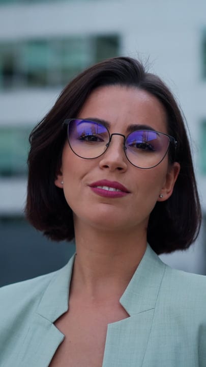 Confident Businesswoman in Vienna with Striking Glasses