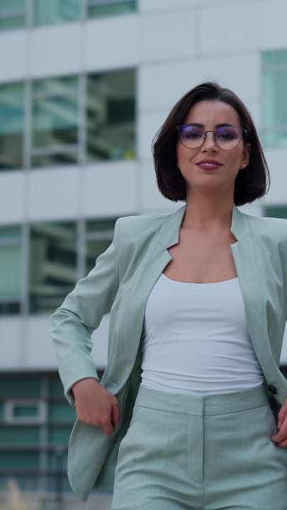 Confident Businesswoman Walking Through Vienna's Urban Landscape