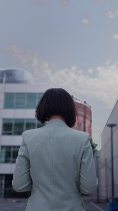 A Businesswoman Embracing Vienna's Urban Horizon
