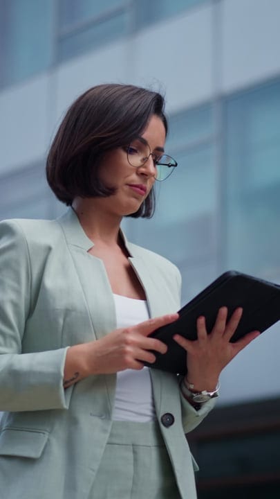 Businesswoman Engaged With Tablet In Vienna's Urban Setting