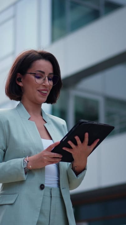 Confident Businesswoman Engages With Her Tablet In Vienna