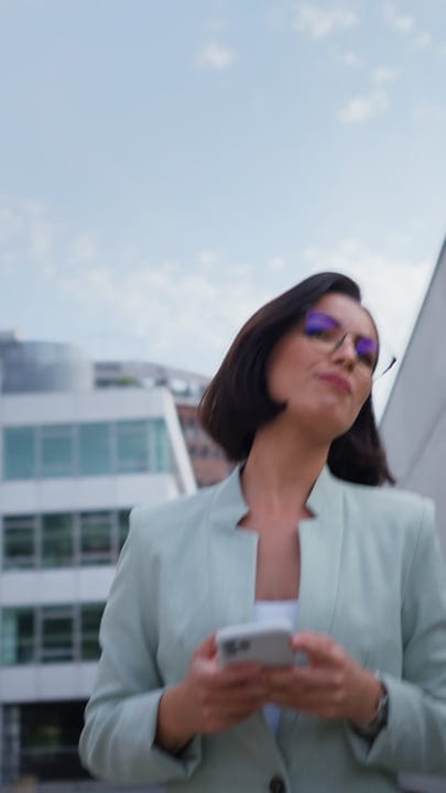 Confident Businesswoman Navigates Vienna's Urban Landscape