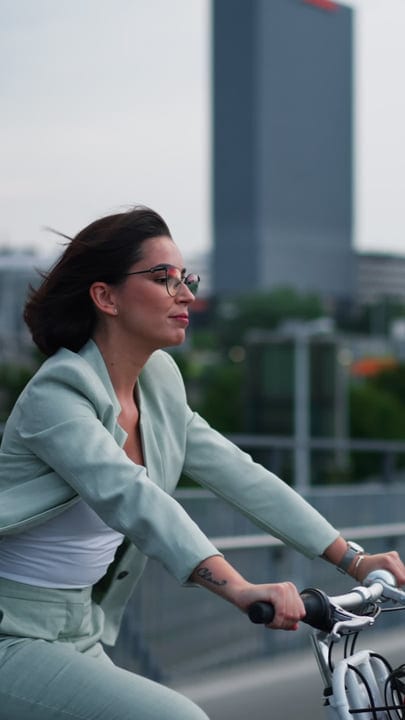 Businesswoman Cycling Through Vienna's Urban Landscape