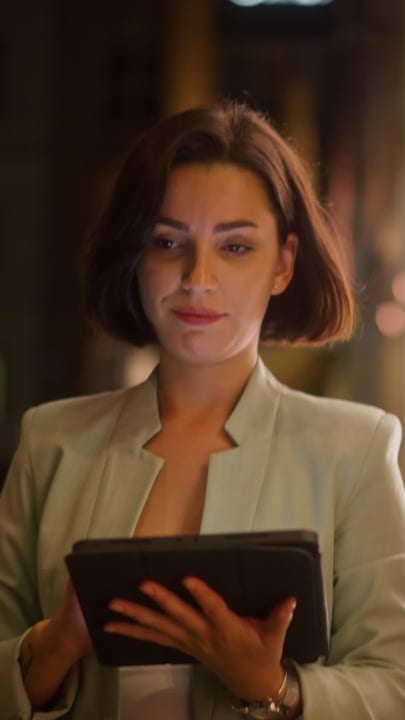 Businesswoman Embraces Evening Ambiance With Tablet in Vienna