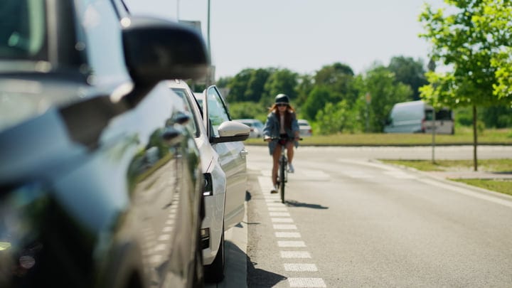 Cyclist Navigates Urban Streets With Confidence and Style