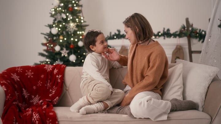 Mother And Child Share A Warm Christmas Moment