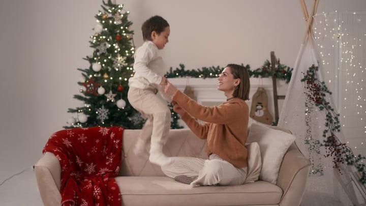 Joyful Playtime By The Christmas Tree With Family