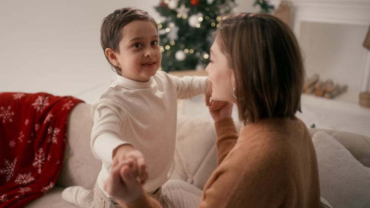 Mother and Child Share a Joyful Christmas Moment