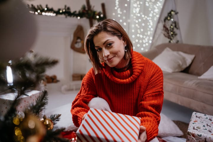 Warm Smiles and Wrapped Gifts at Christmas Eve