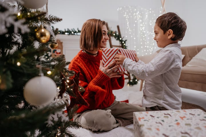 Joyful Exchange Of Gifts Under The Christmas Tree
