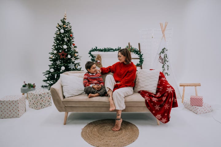 Mother And Child Share A Cozy Christmas Moment