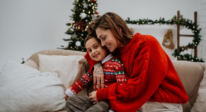 A Cozy Embrace Under The Christmas Tree Glow