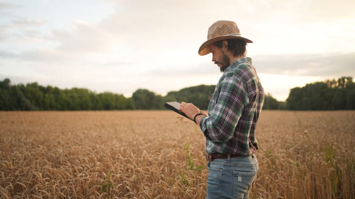 A Farmer Embraces Technology In The Golden Fields