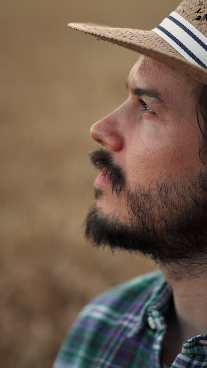 A Farmer's Curious Gaze Into The Autumn Fields