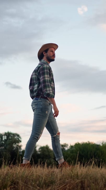 A Farmer Gazes at Evening Skies in Rural Fields