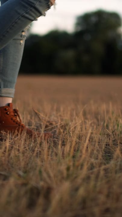 Boots Tread Softly Through Golden Farm Fields