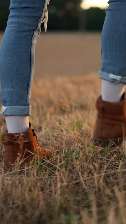 Stepping Through Golden Fields In Autumn Light