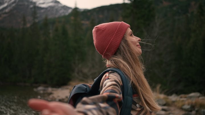 Joyful Hiker Embracing Nature With Open Arms