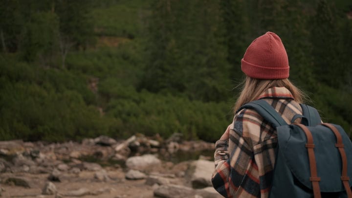 Embracing Nature's Serenity: Female Hiker In Autumn Wilderness