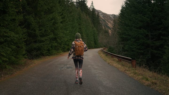 Solitary Hike Through Misty Mountain Trails In Autumn