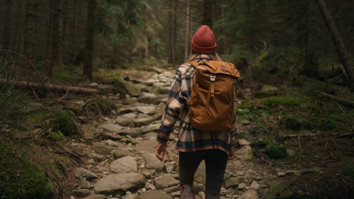 Determined Steps On A Rocky Forest Trail