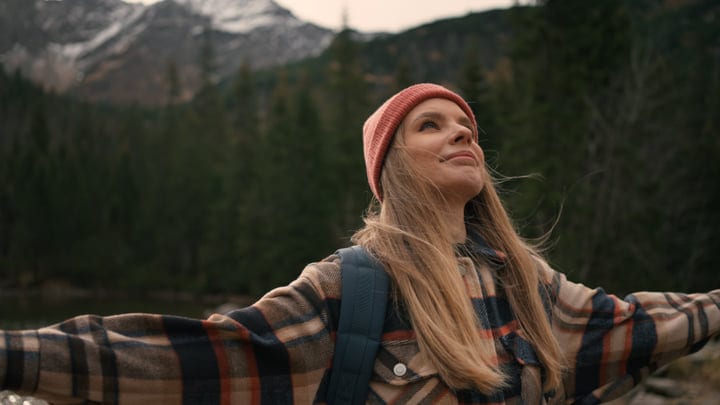 Embracing Nature's Majesty With Open Arms In The Wilderness