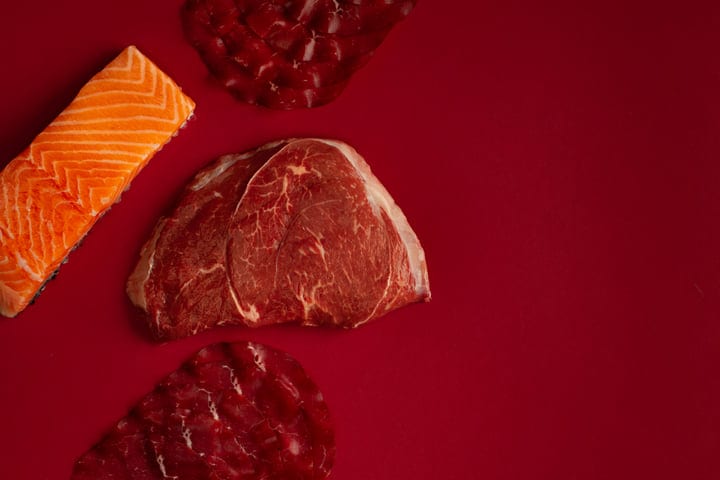 Artisan Cuts of Meat on Rich Red Background