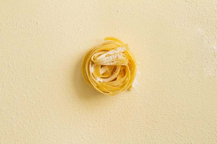 A Single Nest of Tagliatelle with Flour Dusting