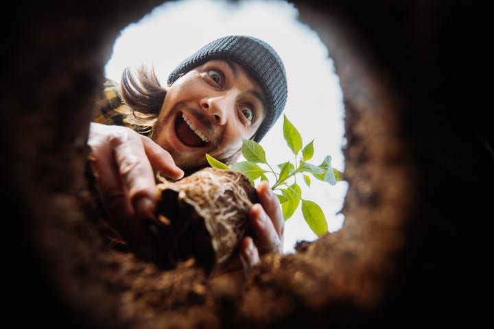 Joyful Gardener Embraces New Growth in the Soil