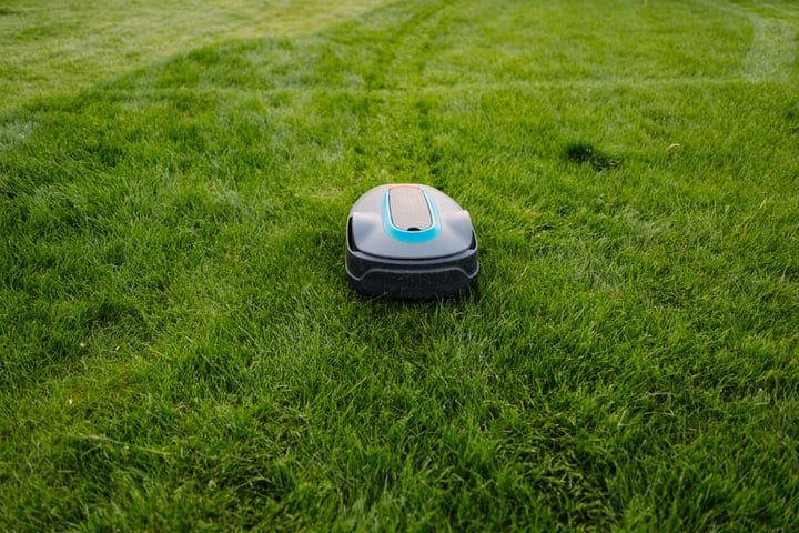 Autonomous Lawn Mower Navigates a Lush Green Garden