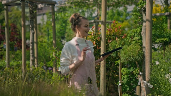 Gardener Enjoys a Morning Among Lush Greenery