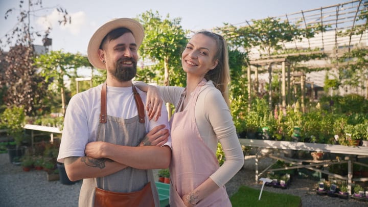 Laughter Among Greenery: A Gardener's Joyful Moment
