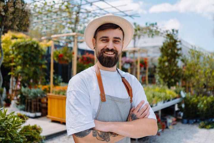 Confident Gardener Embraces the Serenity of His Greenhouse