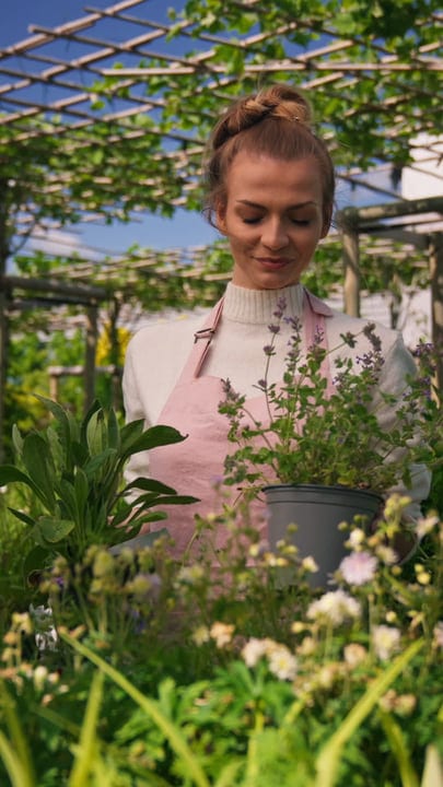 A Gardener Embraces Nature in Her Lush Greenhouse