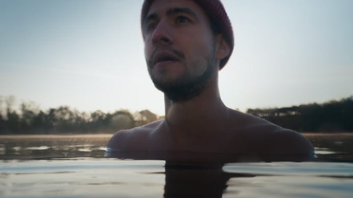 Morning Serenity: Man Embraces Cold Water Swim