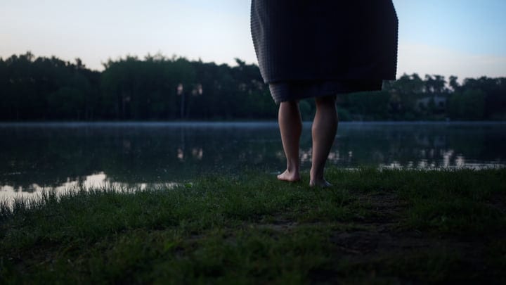 Barefoot On The Lakeside Edge Embracing Tranquility
