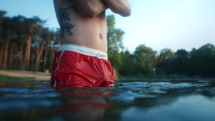 Bracing Against The Chill In A Mountain Lake