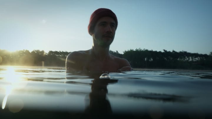 Dawn Breaks As Man Embraces Cold Water Swim